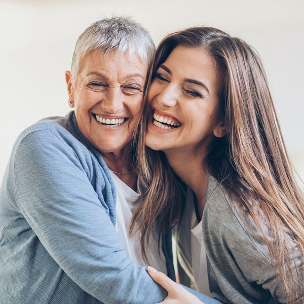 older woman and senior mom smiling